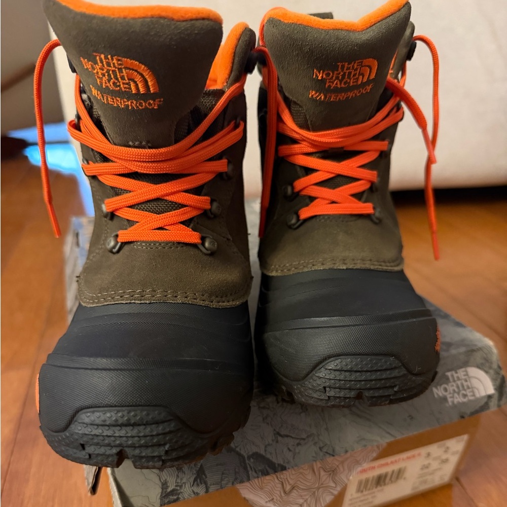 The North Face Kids Waterproof Boots in Olive Green with Orange Accents